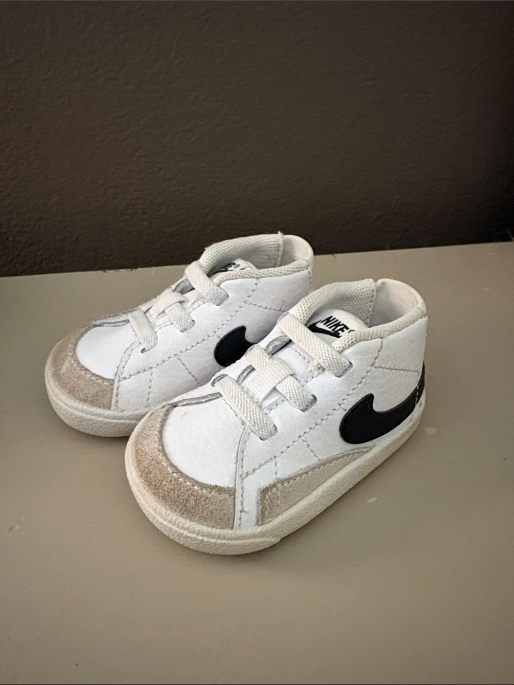 Nike White Kids High-Top Sneakers with Black Swoosh and Tan Accents